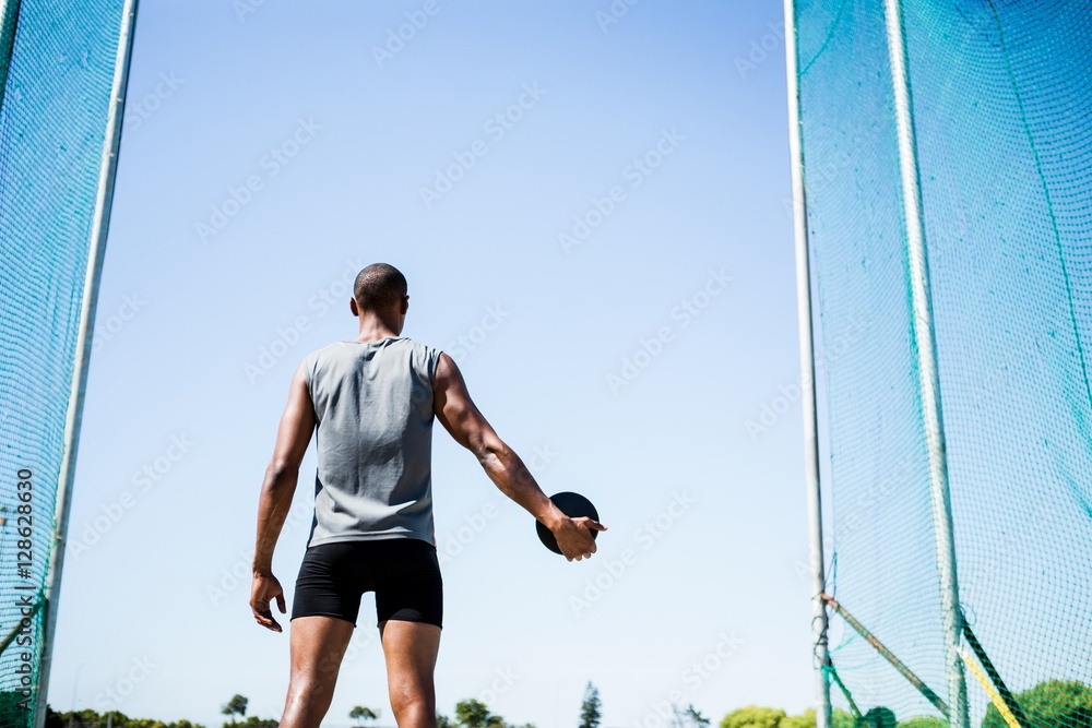 Athlete about to throw a discus Athlete about to throw a discus