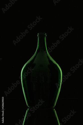 Silhouette of elegant and very old wine bottle