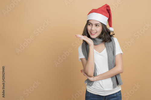 Beautiful christmas girl in santa hat with boxes  on autumn back © tonefotografia