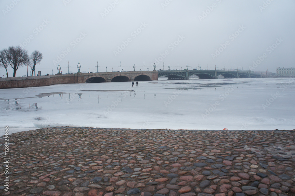 Cityscape of Saint-Petersburg, Russia in winter day view to Neva river and Troitsky or Trinity bridge