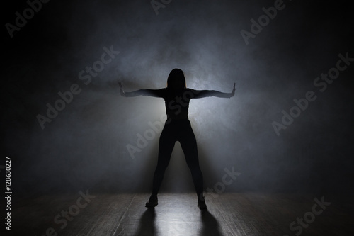 Girl dancing. backlight © semenenkostas