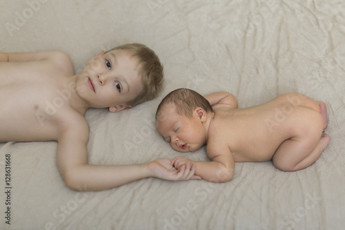 фотографія cute big brother with new newborn baby