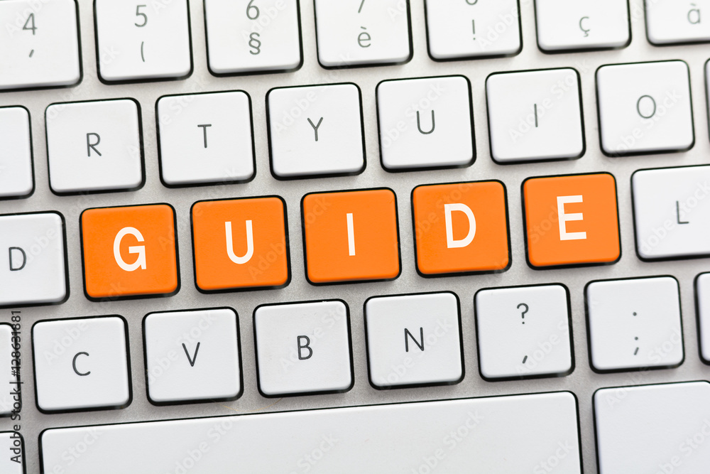 GUIDE writing on white keyboard GUIDE writing on white keyboard