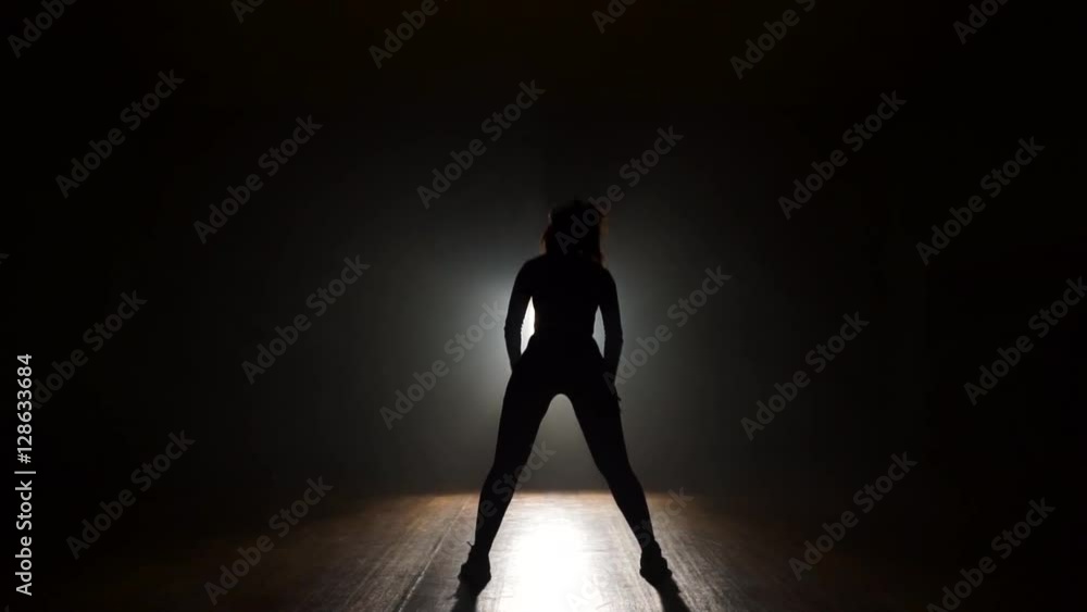 Dancer in studio with smooke on a dark background Dancer in studio with smooke on a dark background