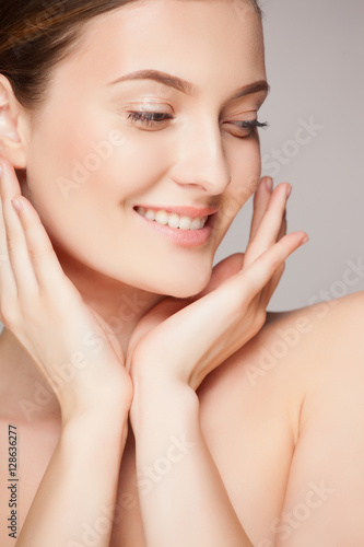 Fashion woman with beautiful face - isolated on white. Skin care concept.