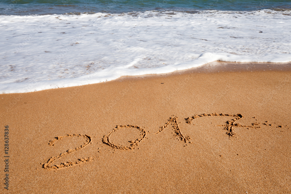 Happy New Year 2017, lettering on the beach Happy New Year 2017, lettering on the beach