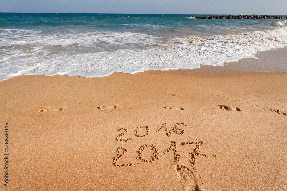 Happy New Year 2017, lettering on the beach Happy New Year 2017, lettering on the beach
