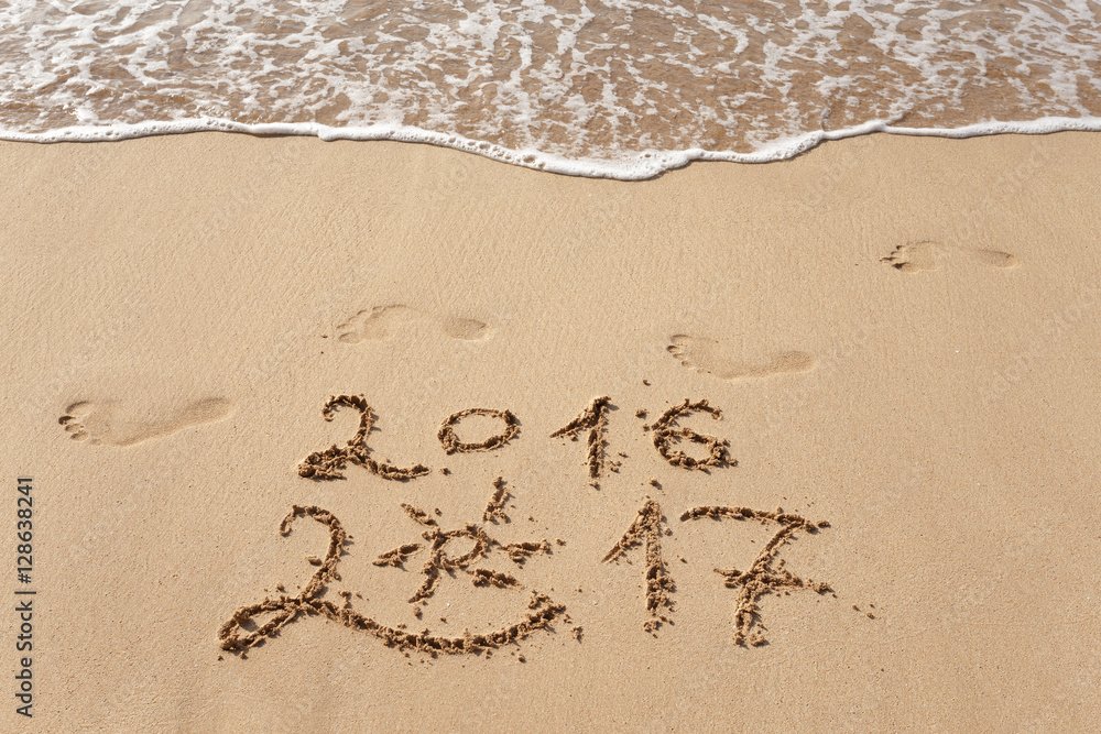 Happy New Year 2017, lettering on the beach Happy New Year 2017, lettering on the beach