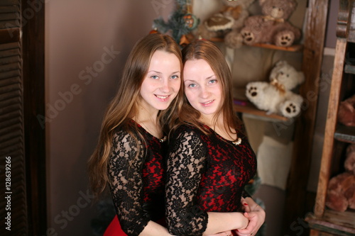 Girl twins celebrating new year  © viktoria_koks