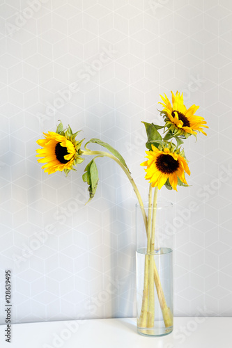 Wallpaper Mural Sunflowers in glass vase on table Torontodigital.ca