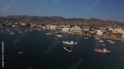 Aerial of great number of little boats and dinghies moored in the harbour of fishing village of Alyki on the island of Paros, Greece. photo