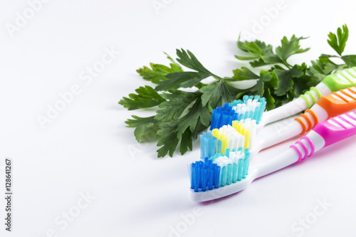 Multicolor toothbrushes on white background