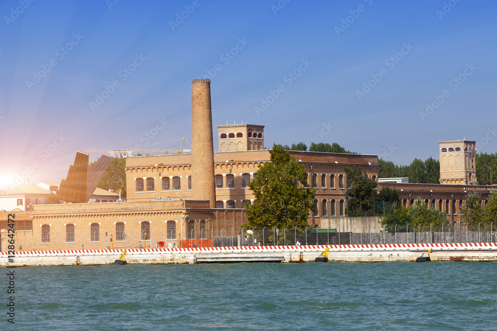 Venice, Italy. Ancient industrial buildings on the bank of the channel.