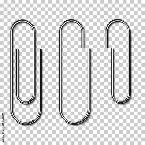 Metal paperclips isolated and attached to paper photo