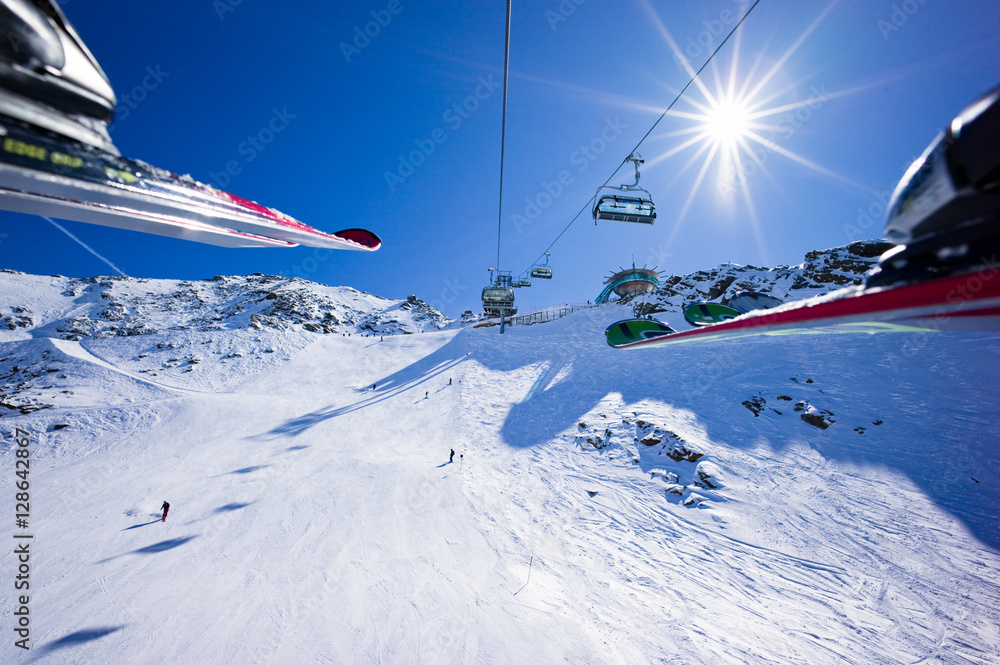 People are riding in chair lift in a ski area. Obergurgl, Austri