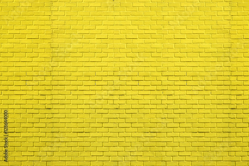 Yellow bricks pattern on wall for abstract background. © tawanlubfah