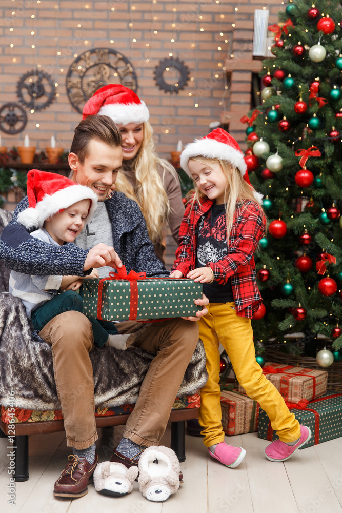 Laughing family at Christmas tree Laughing family at Christmas tree