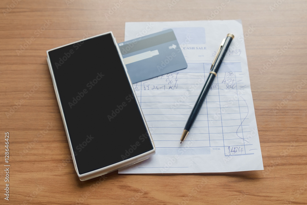 Smartphone and credit card / View of smartphone and credit card on desk office. Shopping on line. Shallow depth of field. Smartphone and credit card / View of smartphone and credit card on desk office. Shopping on line. Shallow depth of field.