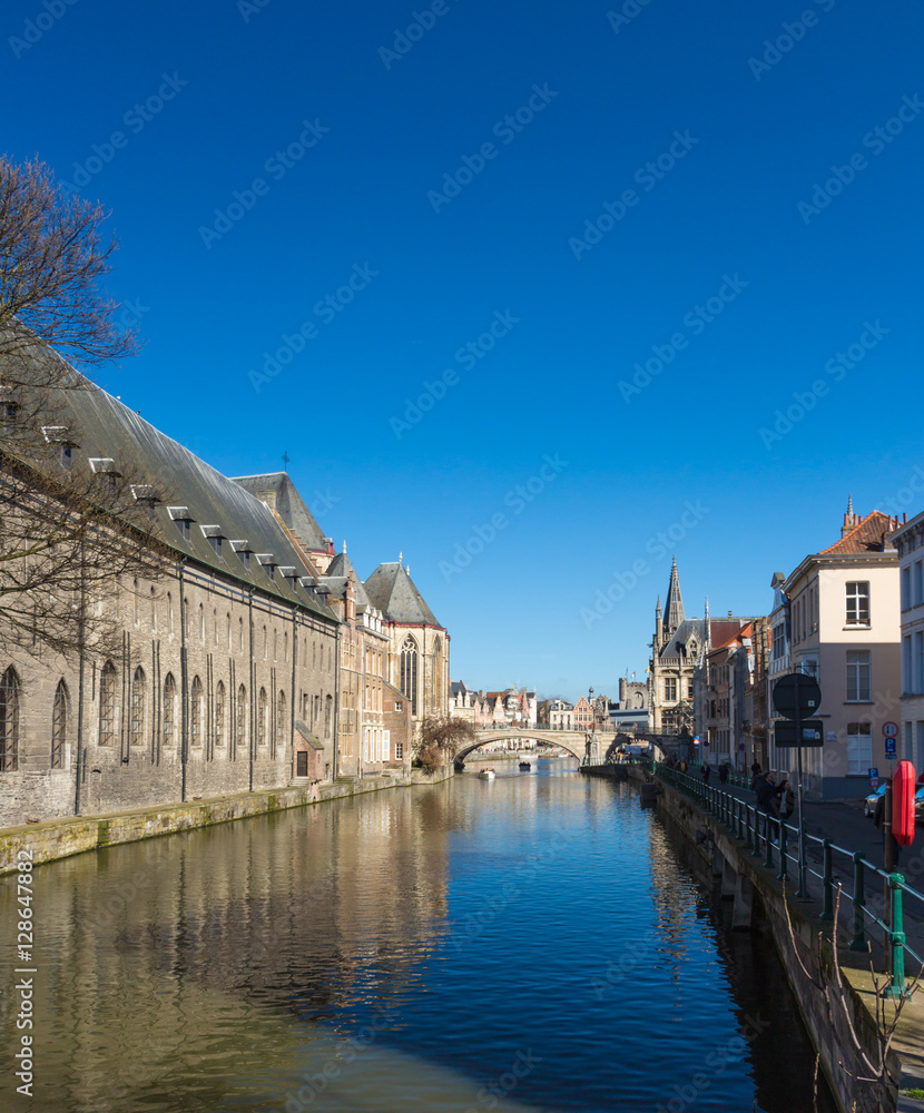 Ghent Old Town Architecture Cityscape and Canal Reflection. View of pictures houses along channel in Ghent.