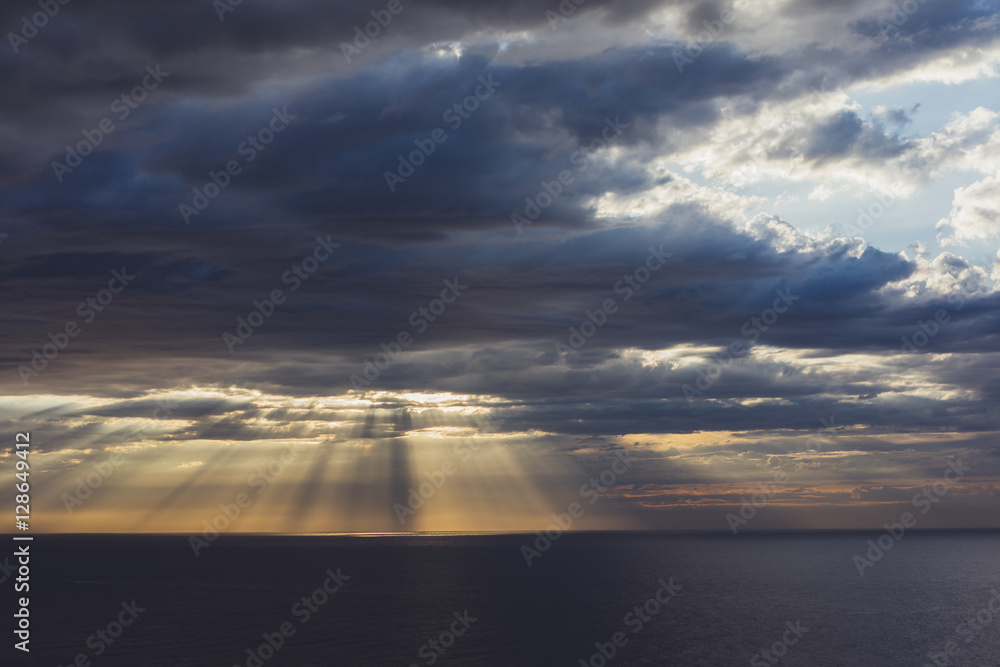 Clouds blue sky and sunlight sunset on horizon ocean . Сloudscape on background seascape dramatic atmosphere rays sunrise. Relax view waves sea, mockup nature evening concept.