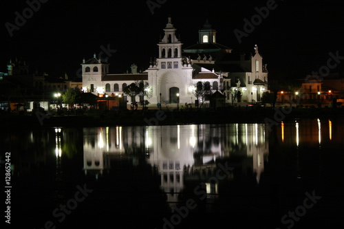 Hermitage of the Rocio at night reflected in water
