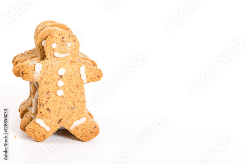 Gingerbread men cookies, on white background with copy-space.