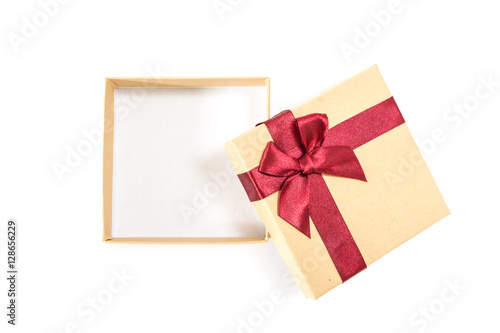 Paper gift box with deep red ribbon with a bow, on white background. © okolaa