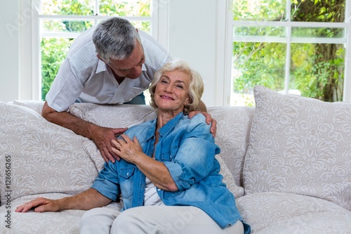 Senior woman touching husband hand while sitting on sofa © WavebreakmediaMicro