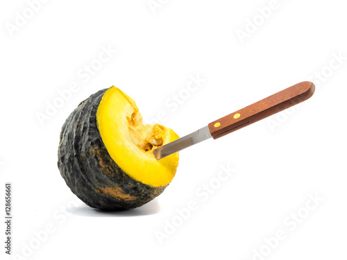 a knife stab equal part pumpkin on white background