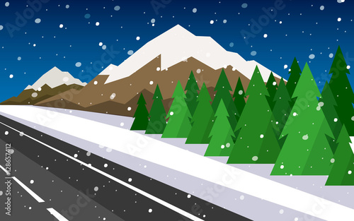 The winter landscape of forests, mountains, road and lake.