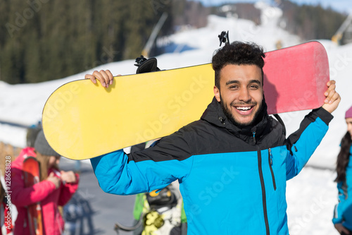 Hispanic Man Hold Snowboard Ski Resort Winter Snow Mountain Cheerful Happy Smiling Guy Holiday Extreme Sport Vacation