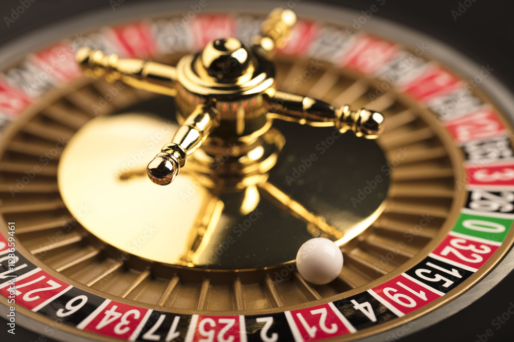 Casino theme. Golden roulette wheel closeup. Casino theme. Golden roulette wheel closeup.