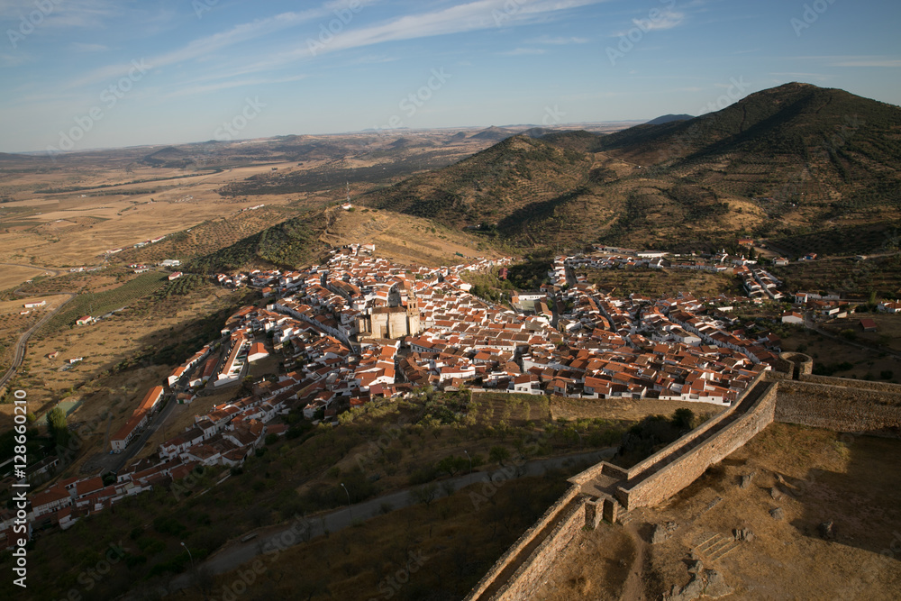 Spanish village next to the walled castle. Feria