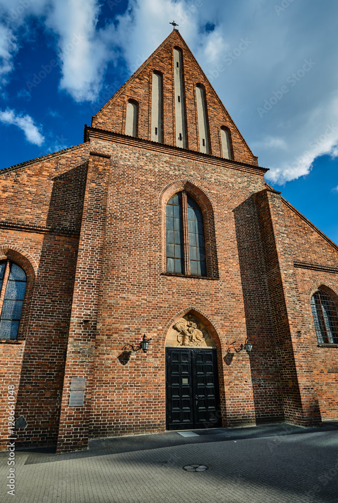 facade of the catholic Gothic church in Poznan