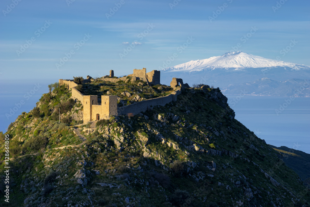 The Sant'Aniceto Castle site near Motta San Giovanni, with in the background Etna vulcano in Sicily, Reggio Calabria , Calabria, Europe, Italy The Sant'Aniceto Castle site near Motta San Giovanni, with in the background Etna vulcano in Sicily, Reggio Calabria , Calabria, Europe, Italy