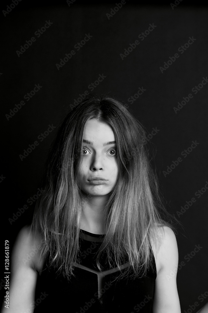 Naklejka premium Young beautiful girl builds faces. Hamming , fun