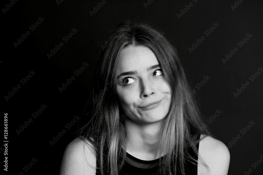 Young beautiful girl builds faces. Hamming , fun Young beautiful girl builds faces. Hamming , fun
