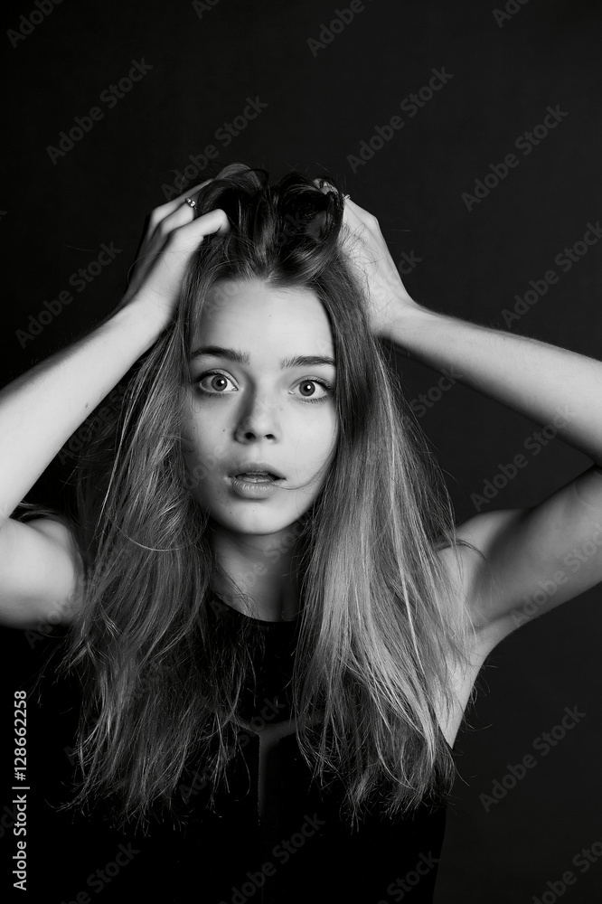 Young beautiful girl builds faces. Hamming , fun Young beautiful girl builds faces. Hamming , fun