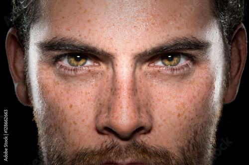 Conviction focused determined passionate confident powerful eyes stare intense athlete exercise trainer male
 photo