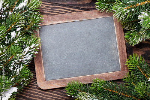 Christmas chalkboard and fir tree with snow
