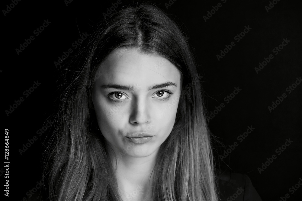 A young girl with long hair. Daring look in . BW A young girl with long hair. Daring look in . BW