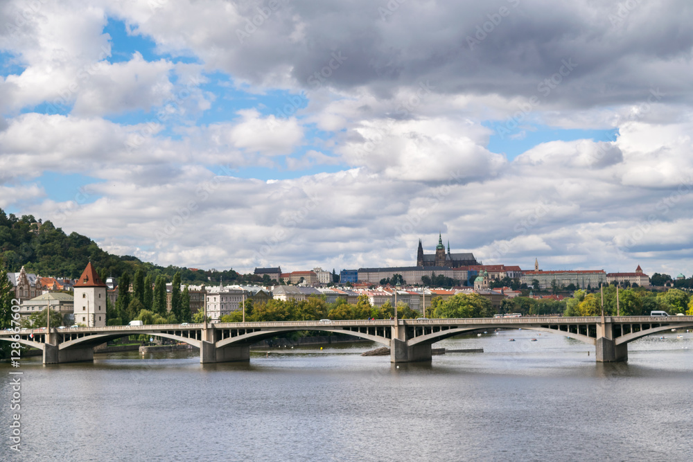 Naklejka premium Dramatic sky, Autumn panorama with Vltava River and Prague Castle, Central Europe, Czech Republic