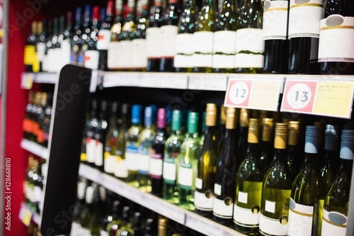 Focus on wine bottle shelf