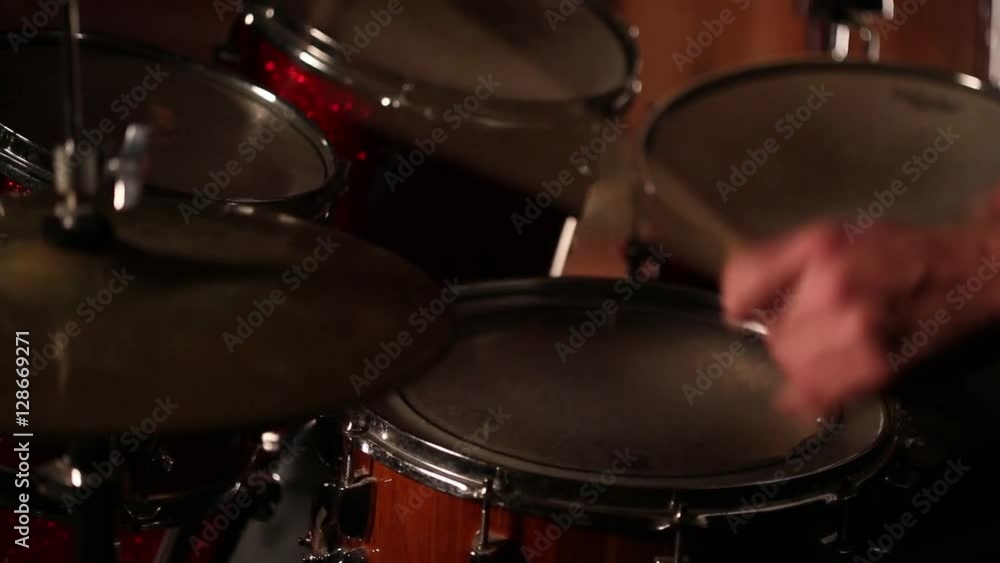 drummer playing on drums in a dark room drummer playing on drums in a dark room