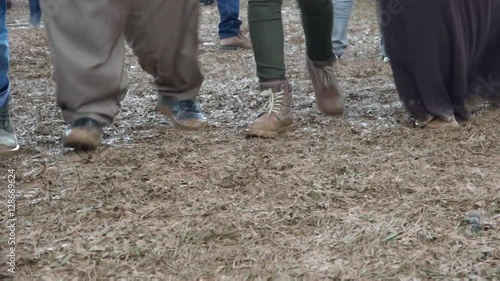 Kurdish dancing, in the mud, for a Kurdish Newroz party in Kurdistan. Turkey