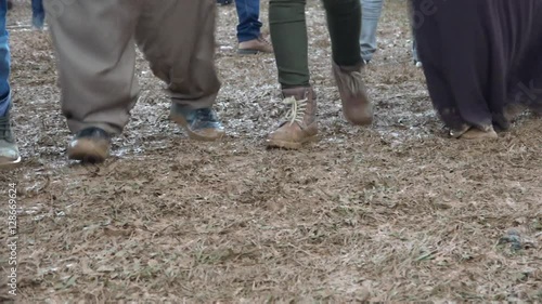 Kurdish dancing, in the mud, for a Kurdish Newroz party in Kurdistan. Turkey photo