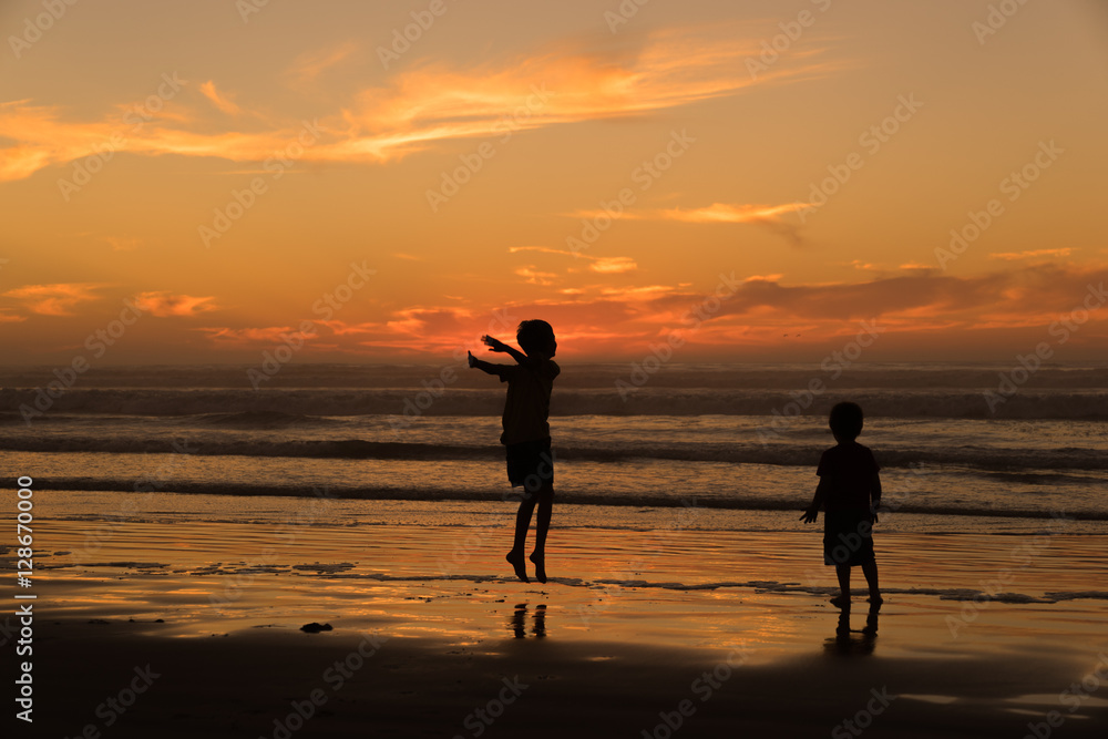 Children Playing in the Surf at Sunset, Pismo Beach California