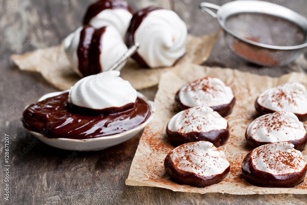 Homemade white meringues with dark chocolate Homemade white meringues with dark chocolate