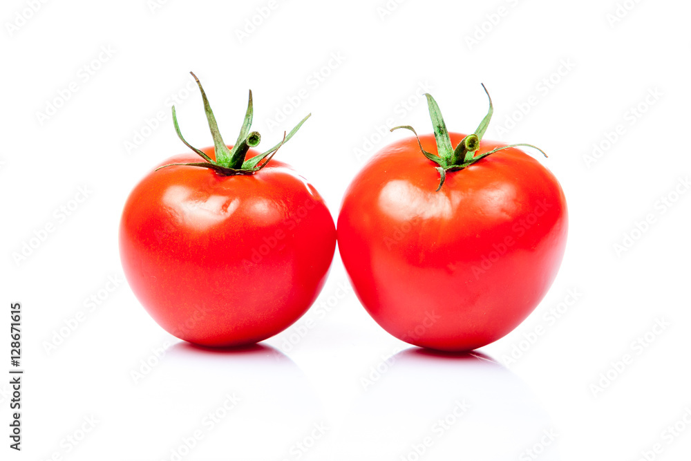 Two tomatoes isolated on a white background Two tomatoes isolated on a white background