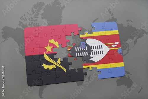 puzzle with the national flag of angola and swaziland on a world map. © luzitanija